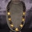 33 inches long Black Polished Kukui Nut Lei with Seven 24K Gold Plated Kukui Nuts
