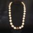 36 inches Long Natural Kukui Nut Lei with a single 18K Rose Gold Center Kukui Nut