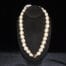31 inch Natural Kukui Nut Lei with 18K Rose Gold Plated Center Kukui Nut